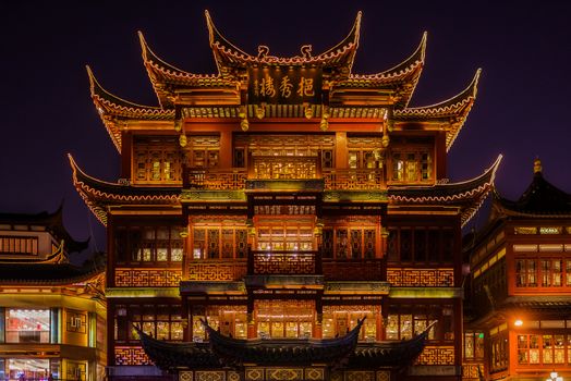 Shanghai, China - April 7, 2013: ancient tea house Fang Bang Zhong Lu old city at night in the city of Shanghai in China on april 7th, 2013