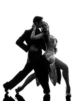 one caucasian couple man woman ballroom dancers tangoing  in silhouette studio isolated on white background