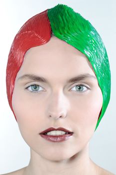 studio shot beauty portrait beautiful green eyes young caucasian woman on a grey background red green cap