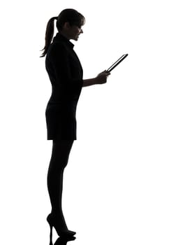 one business woman computer computing digital tablet  silhouette studio isolated on white background