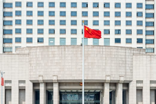 Shanghai, China - April 7, 2013: official chinese military government building on people square shanghai in popular republic of china on april 7th, 2013