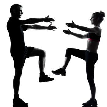 one couple man woman exercising workout aerobic fitness posture full length silhouette on studio isolated on white background