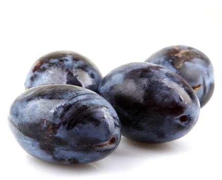 Plums On A White Background