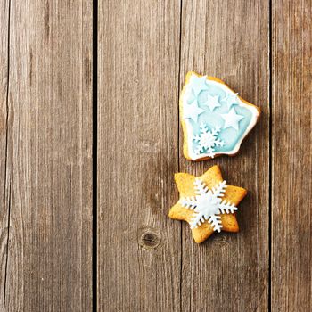 Christmas homemade gingerbread cookie over wooden table