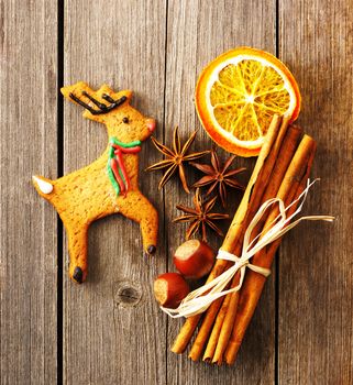 Christmas homemade gingerbread deer over wooden table