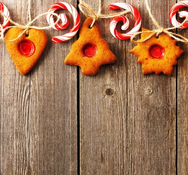 Christmas homemade gingerbread cookies over wooden table