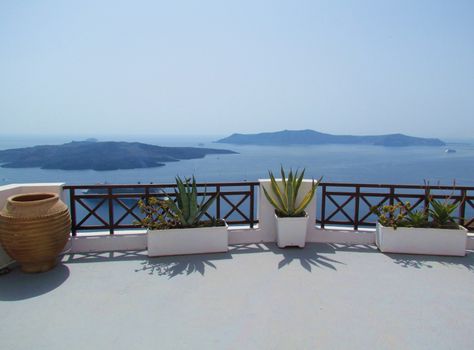 Terrace at Oia with plants, greek island of Santorini, Greece.