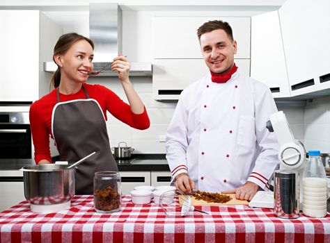 Couple at kitchen cooking together