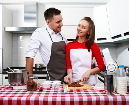 Couple at kitchen cooking together