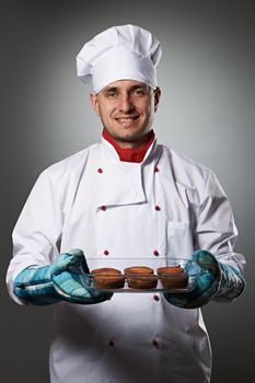 Male chef portrait against grey background