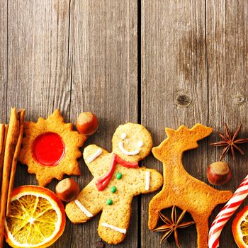 Christmas homemade gingerbread cookies over wooden table