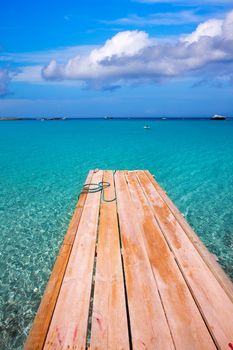 Formentera Ses Illetes beach pier Illetas with Ibiza background at balearic islands