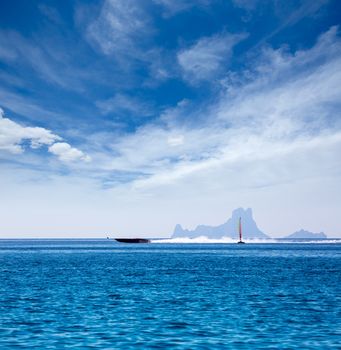 Es Vedra Ibiza silhouette with boats view from Formentera in Balearic islands