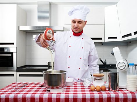 Male chef at kitchen getting ready to cook