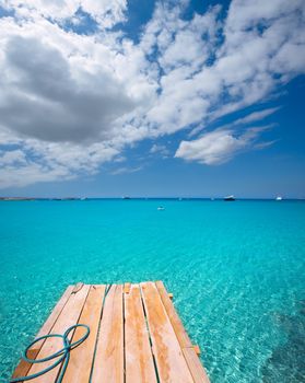 Formentera Ses Illetes beach pier Illetas with Ibiza background at balearic islands