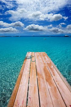 Formentera Ses Illetes beach pier Illetas with Ibiza background at balearic islands