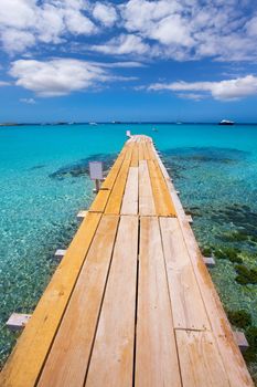 Formentera Ses Illetes beach pier Illetas with Ibiza background at balearic islands