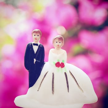 wedding couple doll with retro filter effect