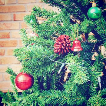 Christmas tree with brick wall, retro filter effect