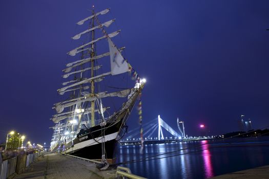 RIGA, LATVIA - JULY 25: Illuminated russian tall ship Kruzenshtern duringThe tall ships races July 25, 2013 Riga, Latvia. Kruzenshtern is four-masted barque and second largest traditional sailing vessel still in operation