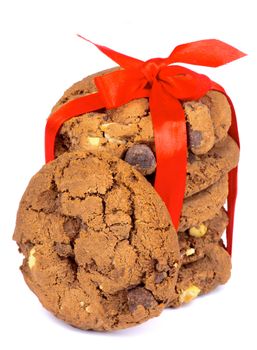 Stack of Delicious Christmas Chocolate Cookies Tied with Red Ribbon and Bow isolated on white background