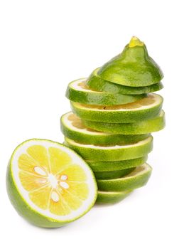 Stack of Fresh Ripe Green Lemons Slices and Half isolated on white background