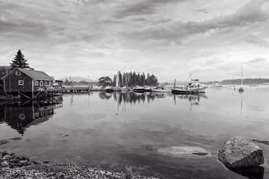 This image shows the dock and watercraft during a foggy morning at Bass Harbor, Maine.