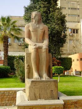 Ancient statue on display outside Egyptian museum, Cairo, Egypt