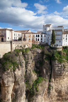 View of buildings in new town from other side of the 18th century bridge over the 300 ft Tajo Gorge in Ronda Spain