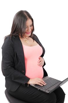 pregnant businesswoman working at laptop
