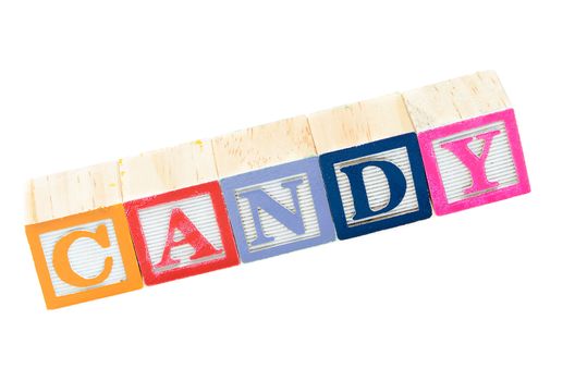 Baby blocks spelling candy. Isolated on a white background.