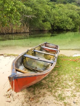 Fishing boat by freshwater river, Rincon beach, Samana Peninsula, Dominican Republic
