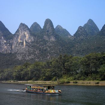 The Li River is in Guangxi Zhuang region of China. It ranges 83 kilometers from Guilin to Yangshuo, where the Karst mountains are a famous landmark.