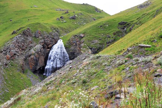 Waterfall Girlish Braids between the mountains of Northern Caucas