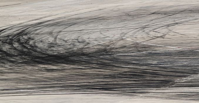 Background with tire marks on road track