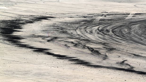 Background with tire marks on road track