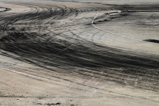 Background with tire marks on road track