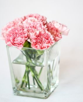 Bouquet of carnation flowers in glass vase