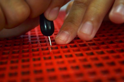 Writing braille. For blind children.