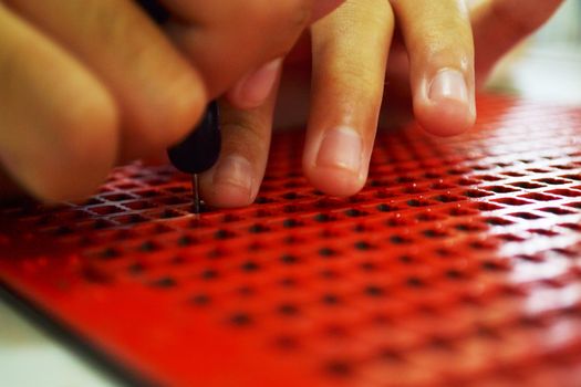 Writing braille. For