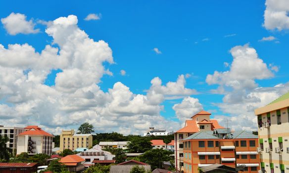 City and house on blue sky.