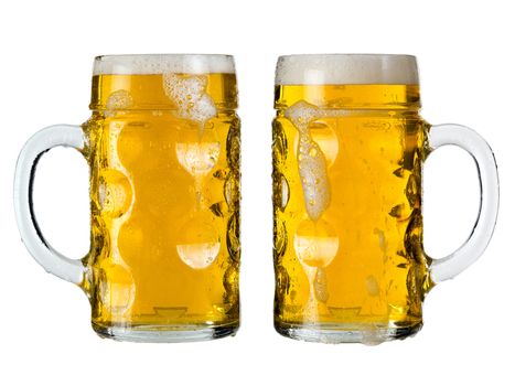 Photo of two traditional Bavarian beer glasses called Mass. Clipping paths included.