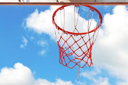 Basketball hoop in the blue sky