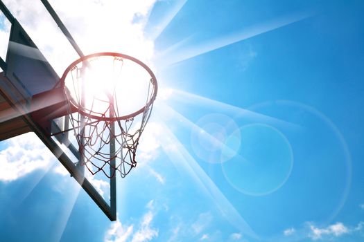 Basketball hoop in the blue sky