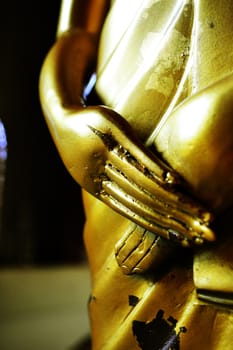 Beautiful golden hand of Buddha statue.
