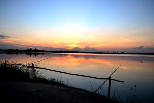 Sunset at the river with Colorful sky and fishing.