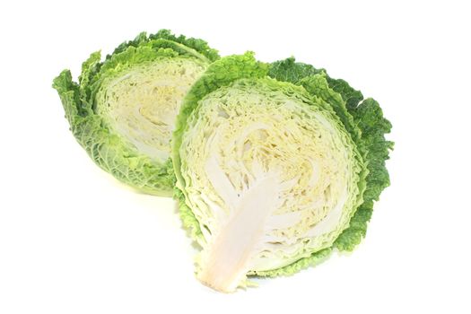 fresh green savoy cabbage halves on a bright background