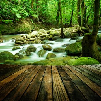 Wood floor perspective and natural mountain waterfall
