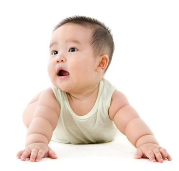 Happy Asian baby boy looking up and smiling. Full body crawling on floor, isolated on white background.