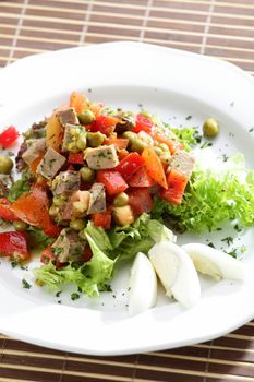 Fresh and tasty salad on the wooden table